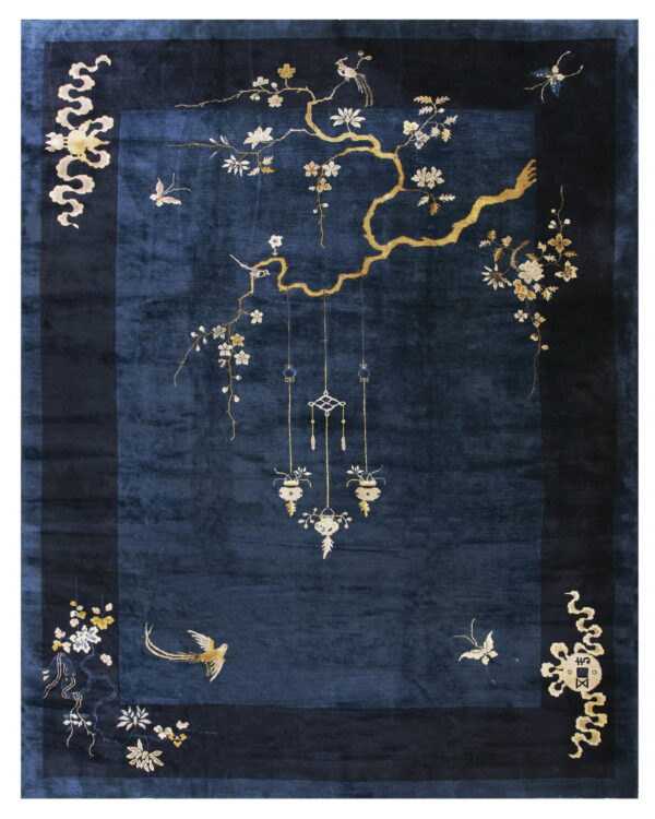 Plush dark blue rug with a wide navy border and elaborate gold botanical and bird motifs.