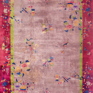 Mauve, magenta, and green rug featuring colorful scattered floral motifs and detailed borders.
