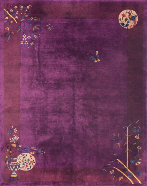 Purple rug with floral and bird motifs.