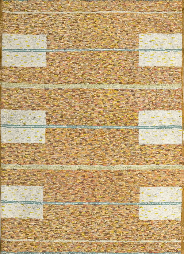 Shaggy rug with textured gold and brown horizontal stripes flanking symmetrical dotted white rectangular blocks.