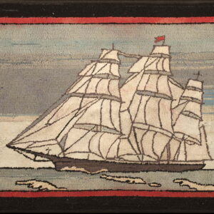 Hooked nautical rug showing a white-sailed ship on the water, framed by red and black pile borders.