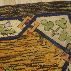 High-pile rug featuring striped yellow and black patterns bordered by cream floral designs on light wood planks.