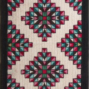 Geometric rug featuring vibrant red, teal, and green diamond shapes on a cream field with a solid black border.
