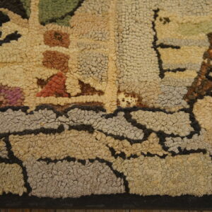 Highly textured, looped rug detail showing beige, gray, green, and terracotta colors with dark outlines.
