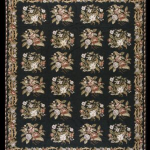 Dark field rug with repeating floral bouquets in white, rust, and mauve, framed by a scrolled border.