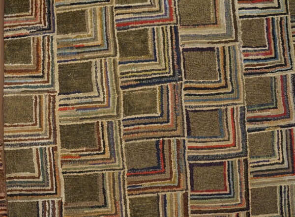 Rustic, textured rug featuring interlocking olive squares outlined in concentric stripes of brown, blue, red, and beige.