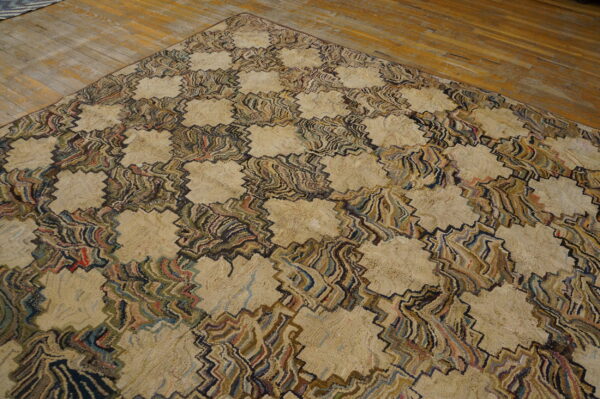 Chunky beige rug with a swirling, multi-colored geometric pattern on rustic hardwood floors.