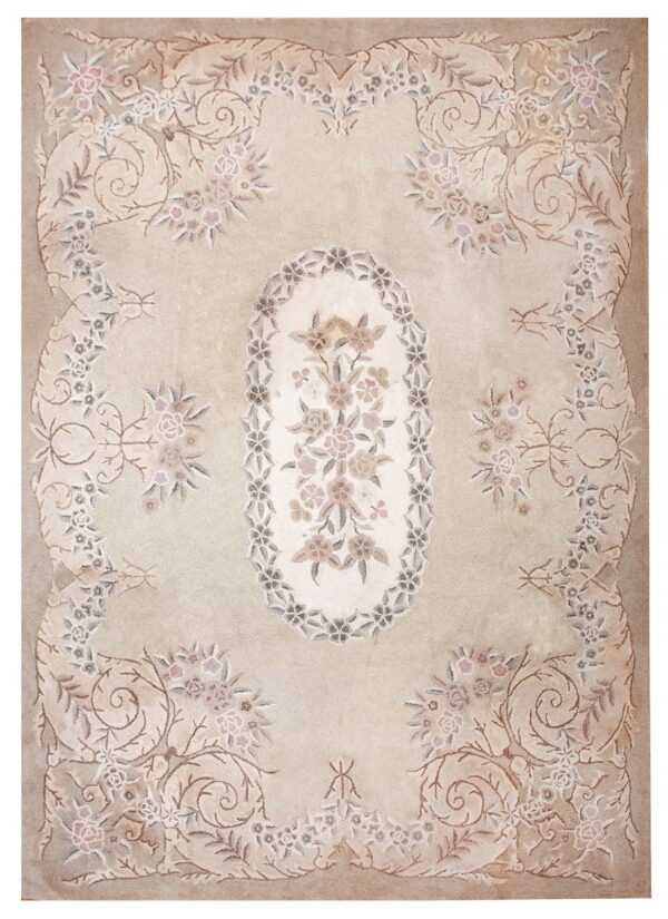 Low-pile beige rug with a detailed floral medallion and scrolling blush and gray traditional border.
