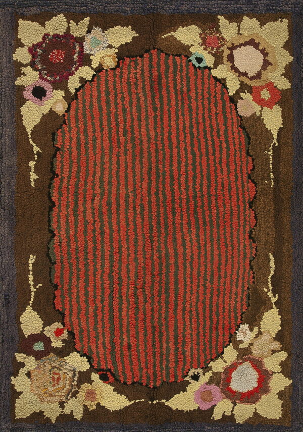 Striped terracotta and dark green hooked rug with a brown field and multicolored floral corner patterns.