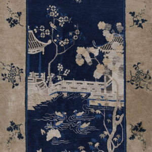 Beige and navy rug depicting a scenic vista with a bridge, pavilion, trees, and flying birds.