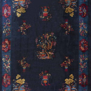 Deep blue Oriental rug featuring colorful central pagodas and red bird motifs within a wide floral border.