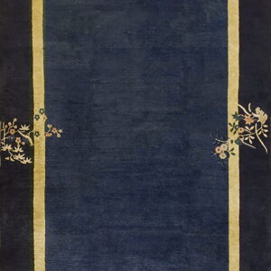 Deep blue rug with a gold inner border framed by a dark edge featuring birds and floral patterns.