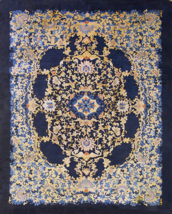 Ornate navy blue rug with a dense golden yellow floral and vine pattern around a central medallion.