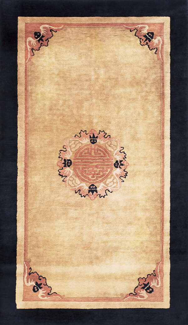 Tan runner rug displaying a central rose medallion and detailed black and pink corner motifs on a solid field.