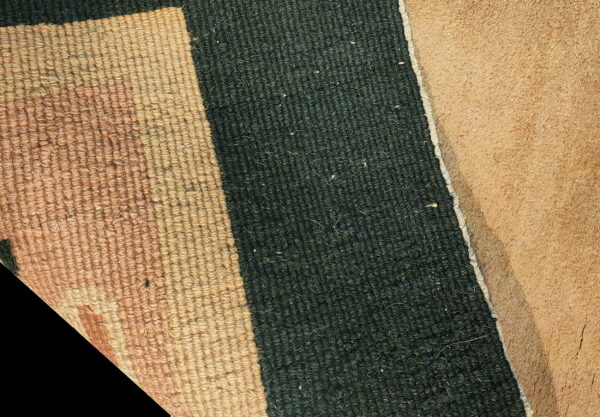 Tan loop pile and dark green low pile texture are visible next to a brown rug backing.