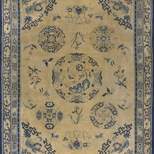 Beige field rug with a complex blue pattern of medallions, symbolic animals, and geometric borders.