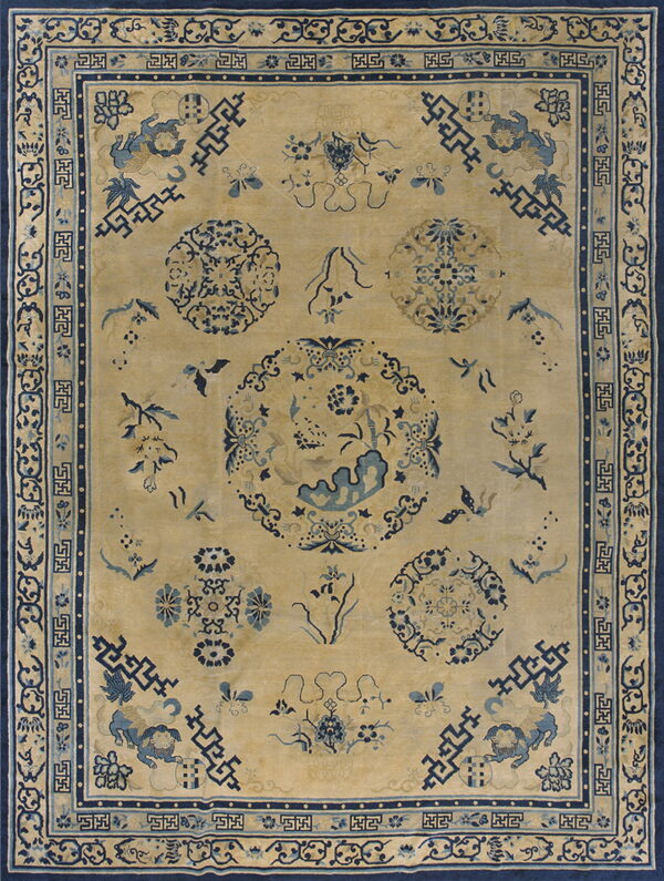 Beige field rug with a complex blue pattern of medallions, symbolic animals, and geometric borders.