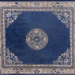 Deep blue antique square rug featuring a beige central medallion and ornate floral borders.