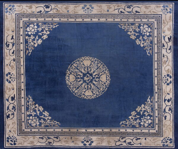 1920s floral medallion wool antique hand knotted blue square rug 1 Deep blue antique square rug featuring a beige central medallion and ornate floral borders.