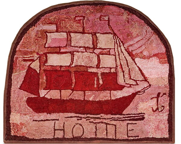 Arched hooked rug in red and pink featuring a sailing ship motif and the word home.