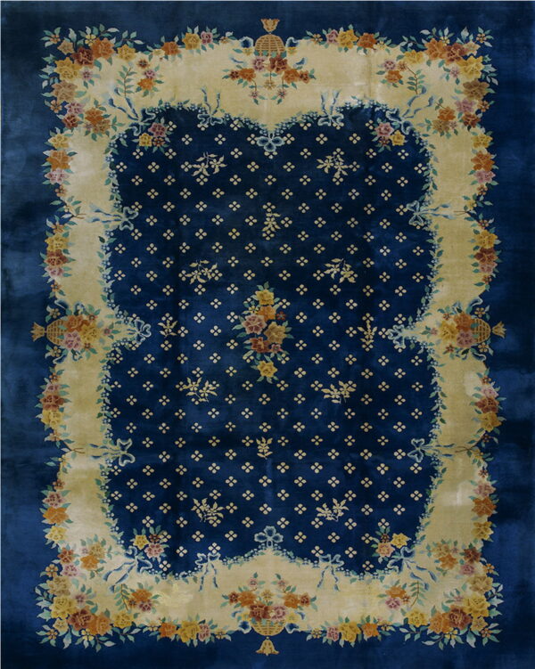 Rich blue rug with a yellow scalloped frame decorated with lush multicolor floral bouquets and ribbons.