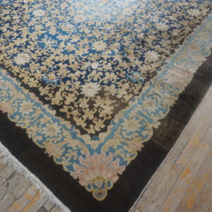 Antique blue Chinese rug with floral design.