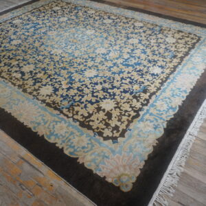Antique Chinese rug with intricate patterns.