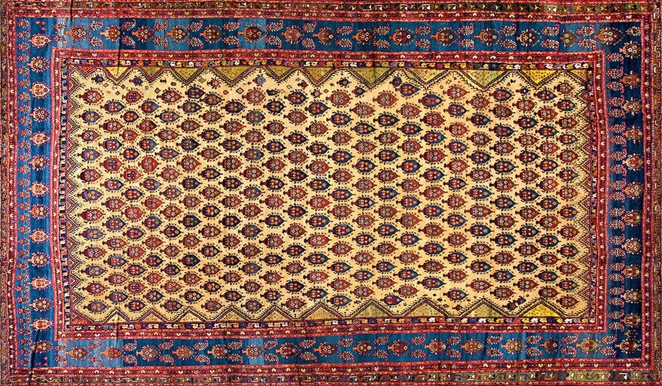 Full shot of antique distressed yellow wool rug with central medallion and floral borders - by rugs on net