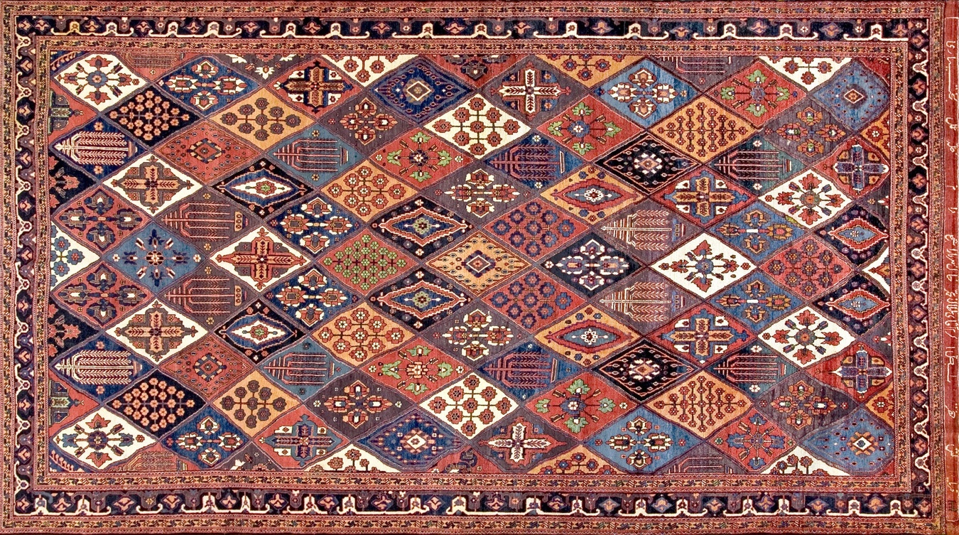 Detail view of the antique bakhtiari persian rug, highlighting the geometric patterns and deep colors - by rugs on net