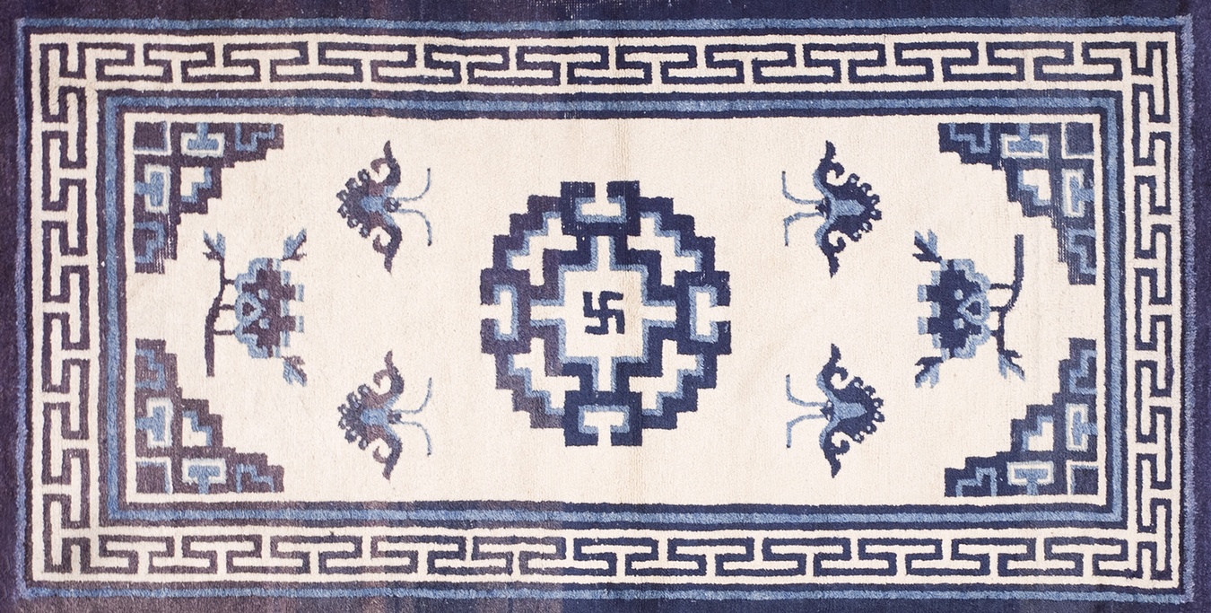 Detailed view of an antique chinese mongolian rug, featuring ivory wool and subtle pattern elements - by rugs on net