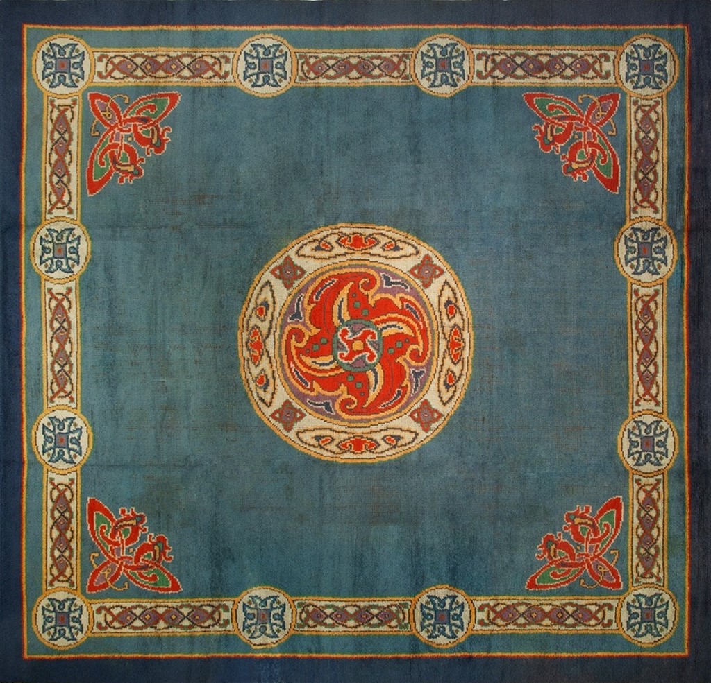 Antique donegal arts and crafts room-size wool rug displayed in deep blue tones - by rugs on net