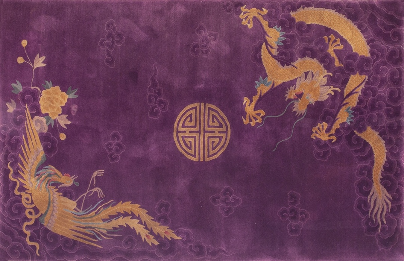 Detailed view of an antique caucasian rug featuring vibrant red and indigo dragon motifs - by rugs on net