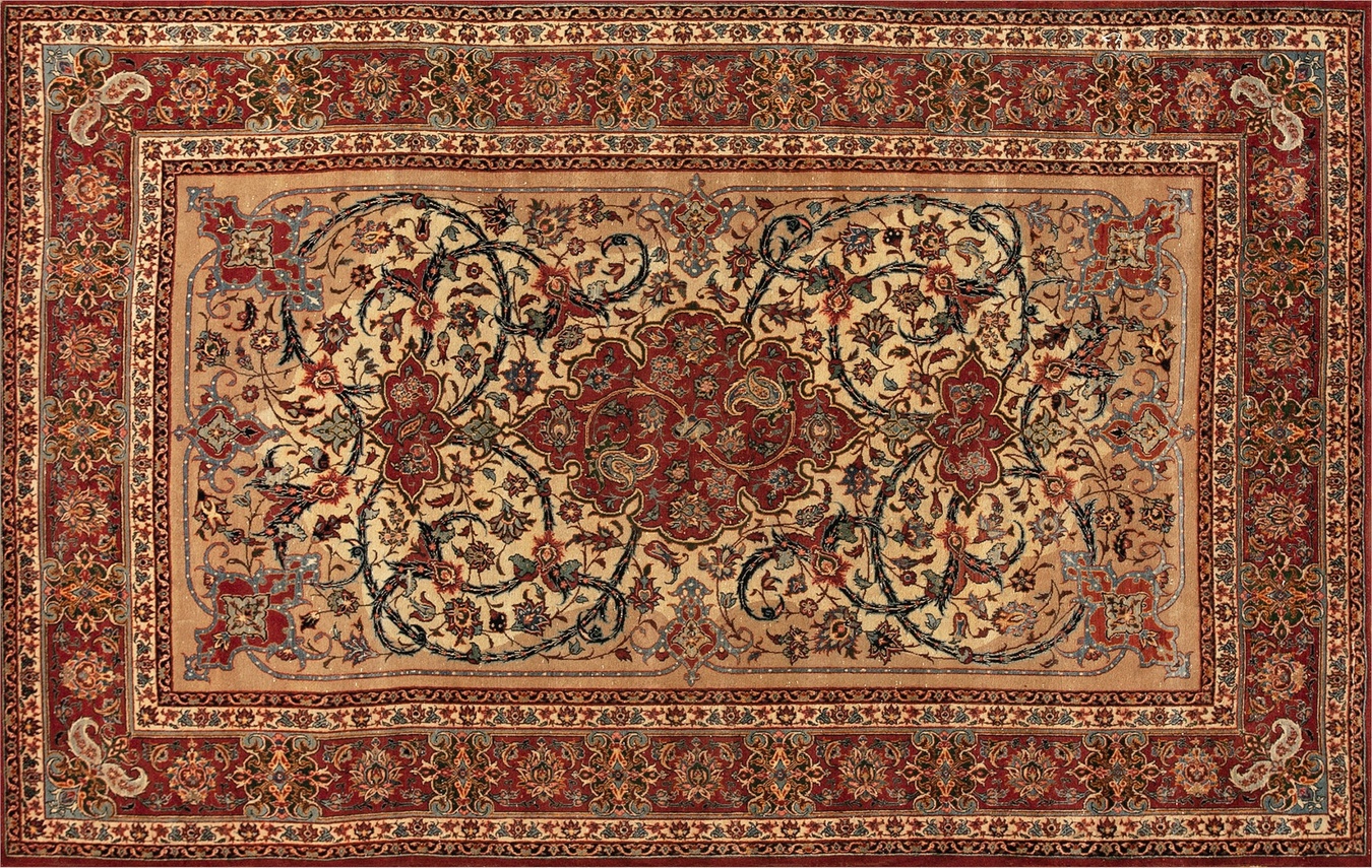 Antique persian isfahan rug with an ivory field and intricate red floral medallion design - by rugs on net