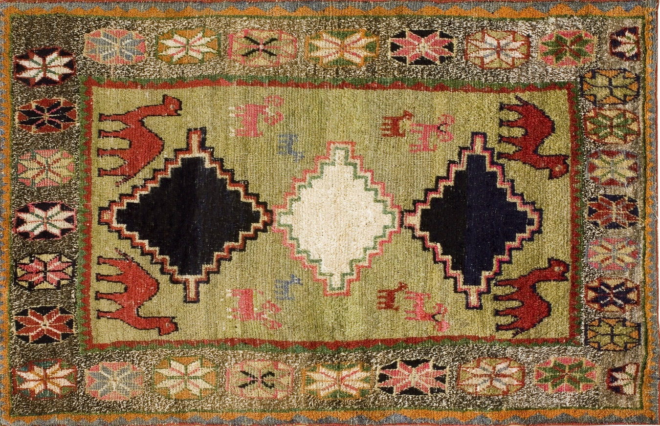 Detailed view of an antique gabbeh small scatter size wool green rug - by rugs on net