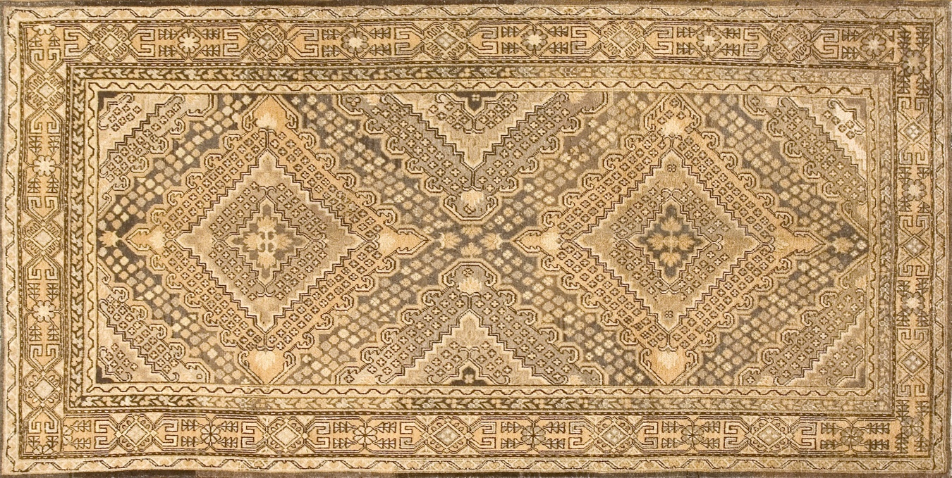 Full view of an antique khotan hand-knotted pile rug displaying an allover geometric pattern - by rugs on net