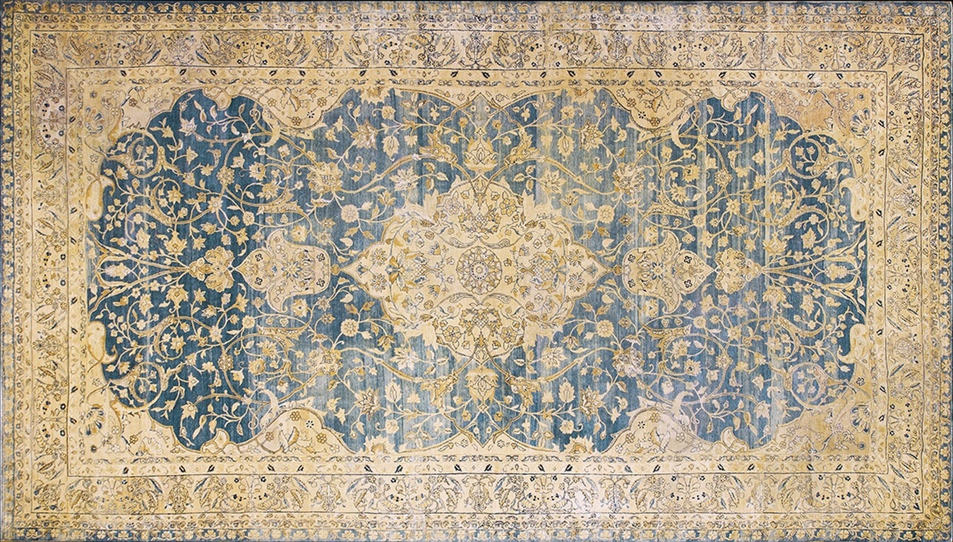 Large room size antique kirman wool rug featuring a deep blue field and intricate floral medallion - by rugs on net