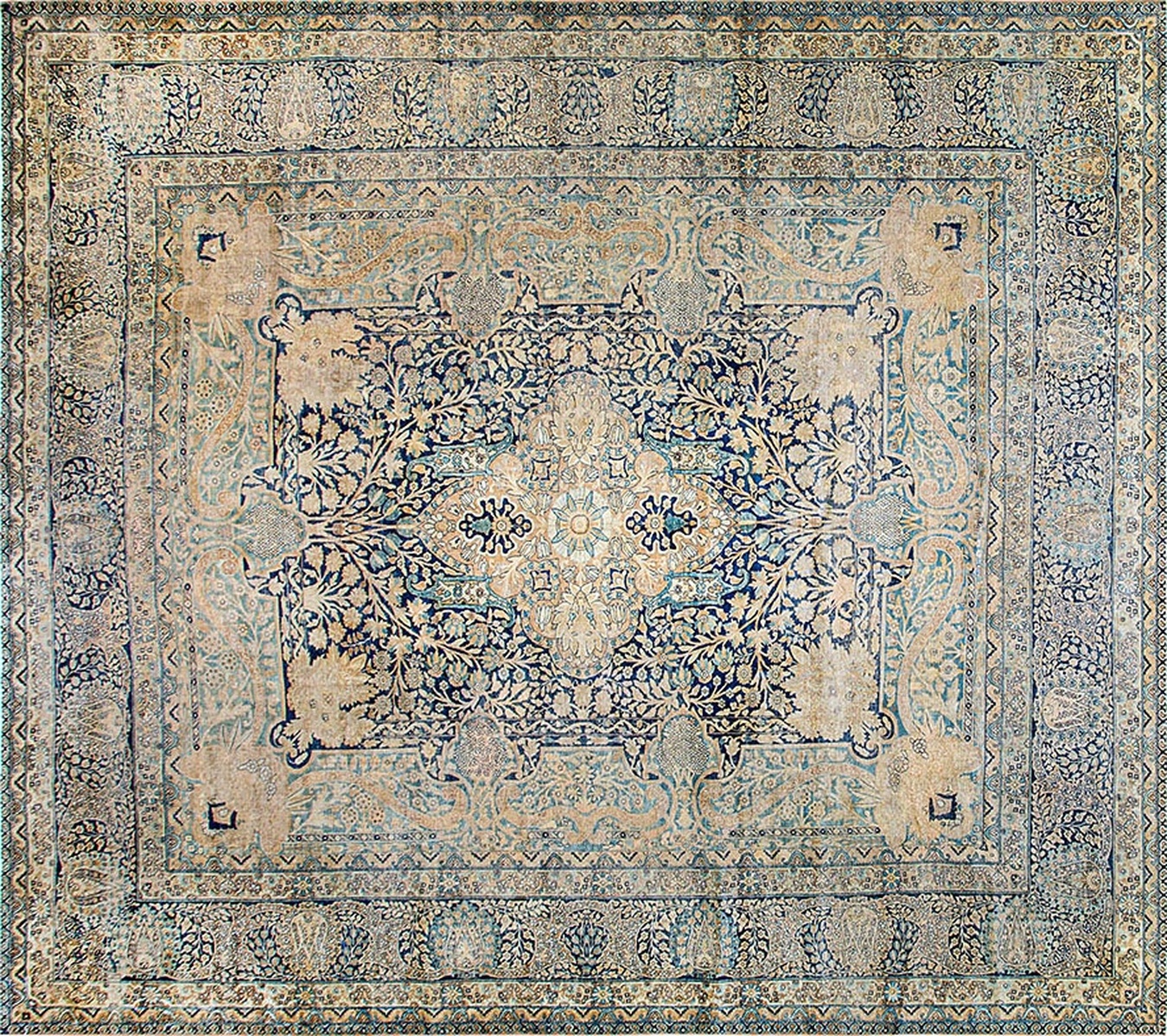 Detailed close-up of a large antique kirman persian rug featuring intricate floral medallions and muted colors - by rugs on net