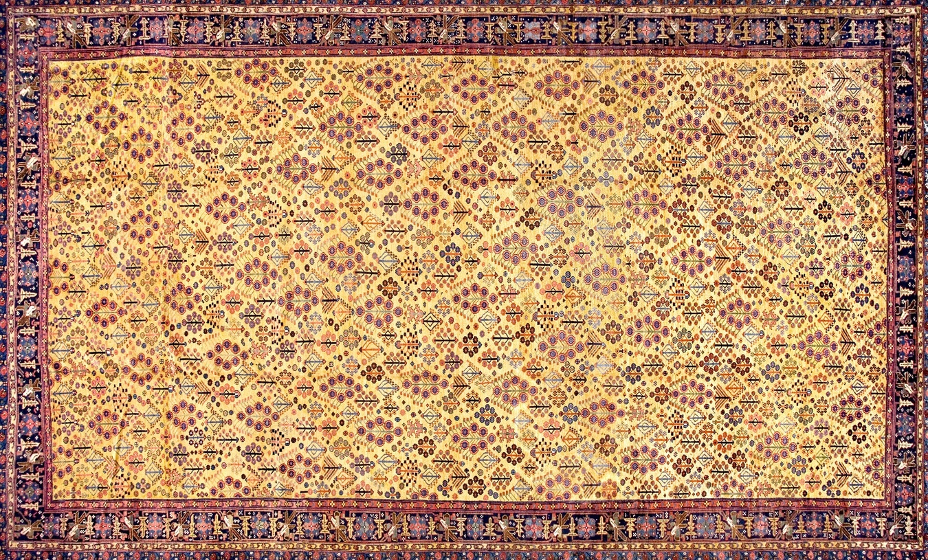 Oversized antique northwest persian wool rug featuring traditional medallion design and rich gold and yellow tones - by rugs on net