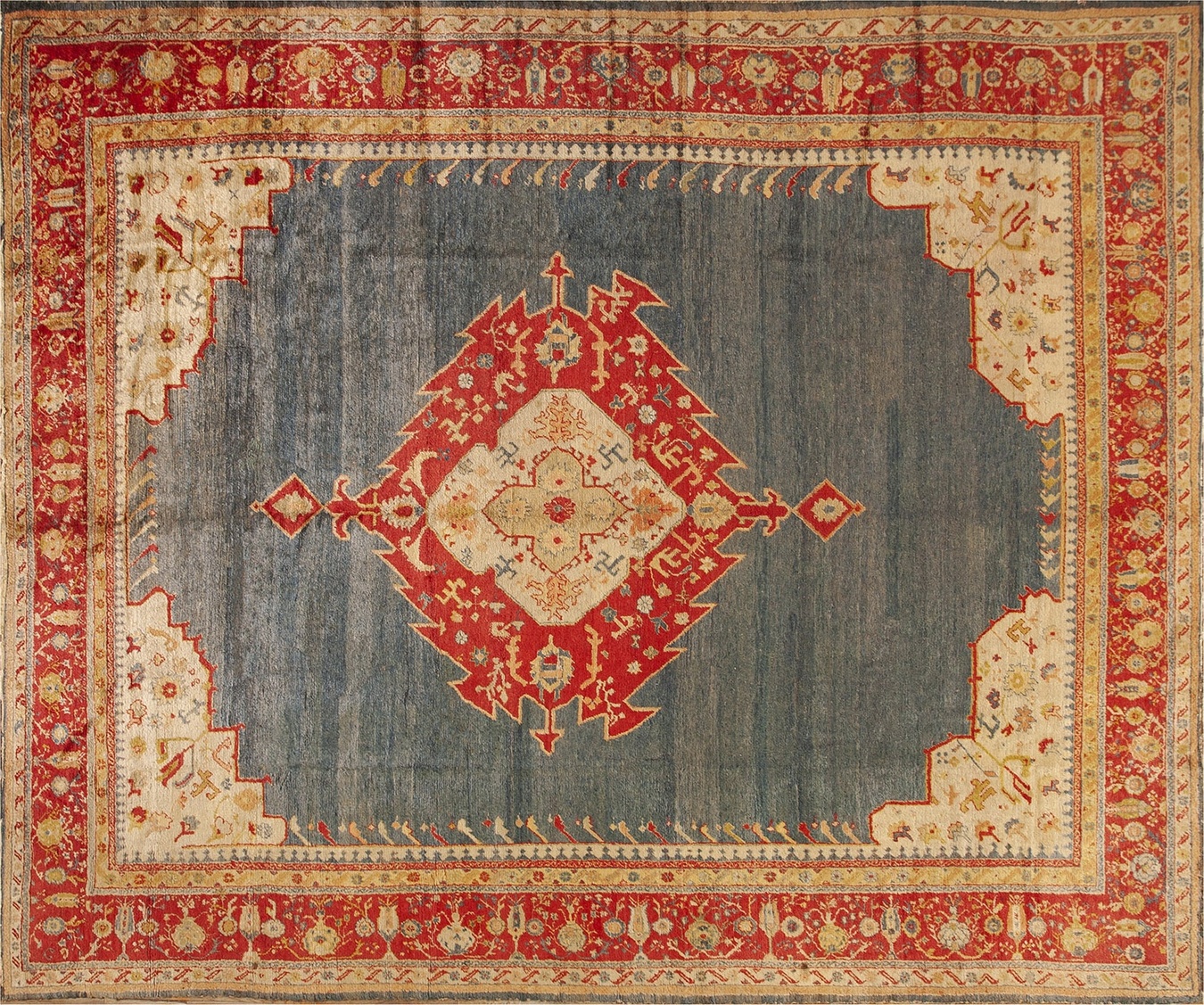 Antique room-sized oushak rug displaying angora blue tones and classic turkish floral patterns - by rugs on net