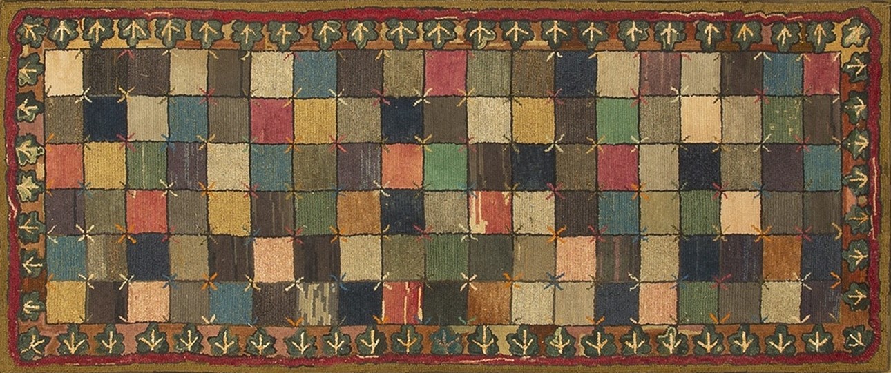 Close-up showing the richly colored, intricate geometric pattern and soft wool texture of this antique rug - by rugs on net