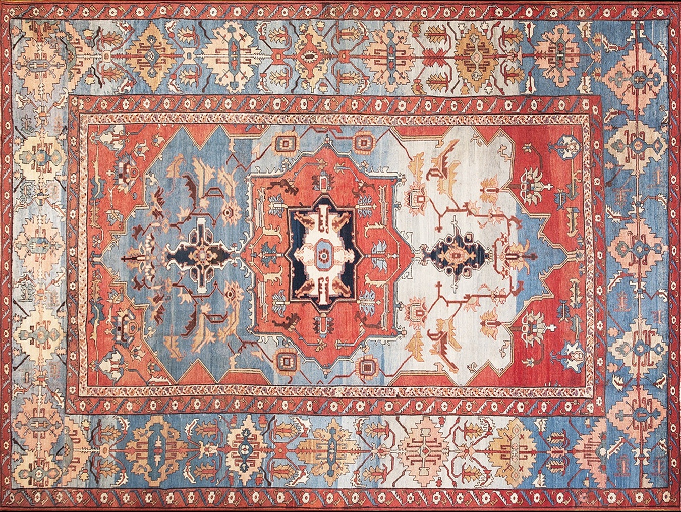 Large antique wool serapi rug featuring a bold geometric pattern and predominant blue field - by rugs on net