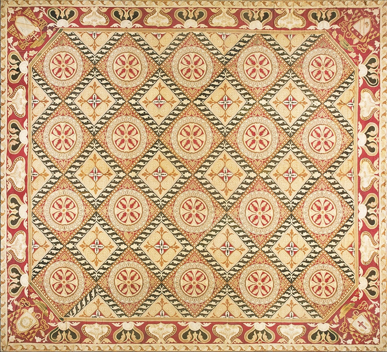 Full view of the antique shieold geometric patterned rug showing central medallions and coat of arms pattern - by rugs on net