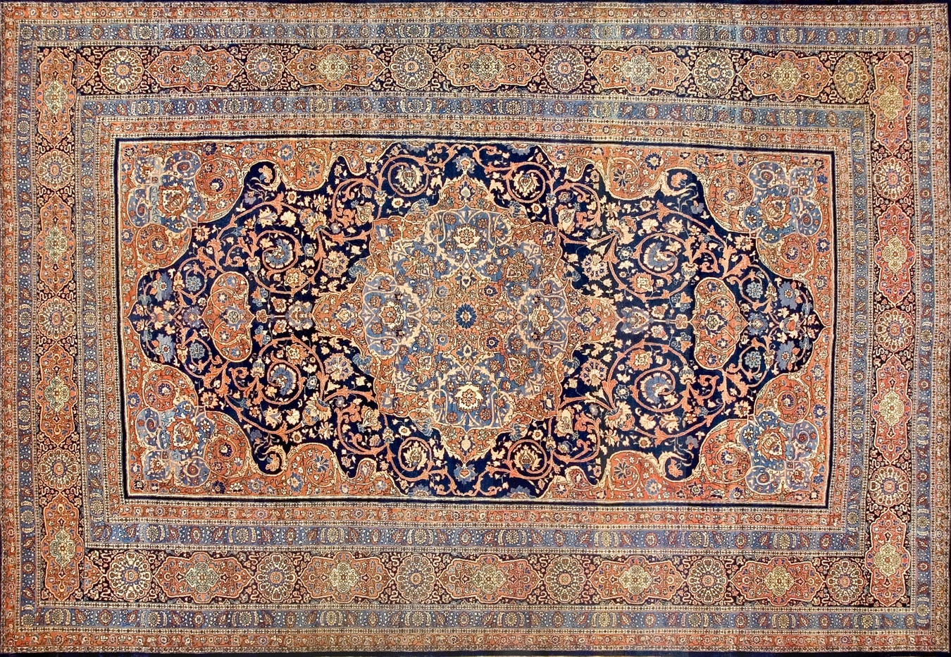 A vintage blue and ivory persian tabriz rug featuring a detailed floral medallion pattern - by rugs on net