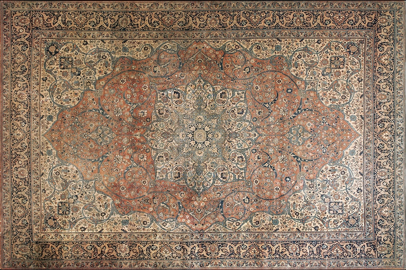 Antique tabriz persian rug showing complex floral borders and a detailed central medallion - by rugs on net