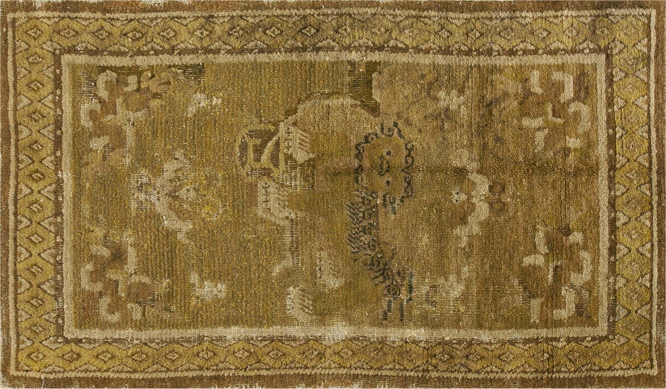 Antique chinese tibetan hand-knotted rug featuring warm yellow tones and an elegant floral medallion pattern - by rugs on net