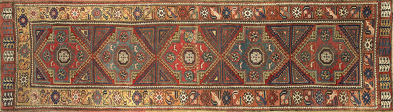 Full view of a large antique turkish hand-knotted wool area rug in traditional colors - by rugs on net