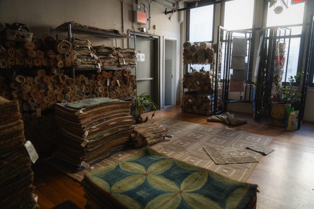 Rugs on net's wholesale display displaying a wide array of options