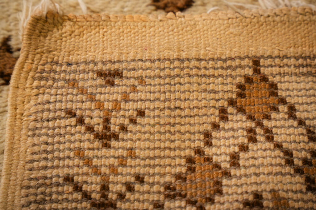 close-up of the backside of a Vintage Moroccan-style rug showing woven knots