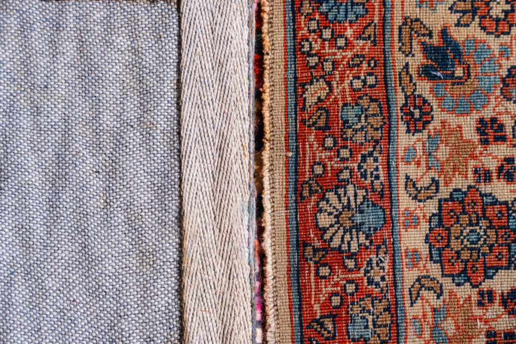close-up comparison of a handmade rug front and backside showing detailed knots and pattern