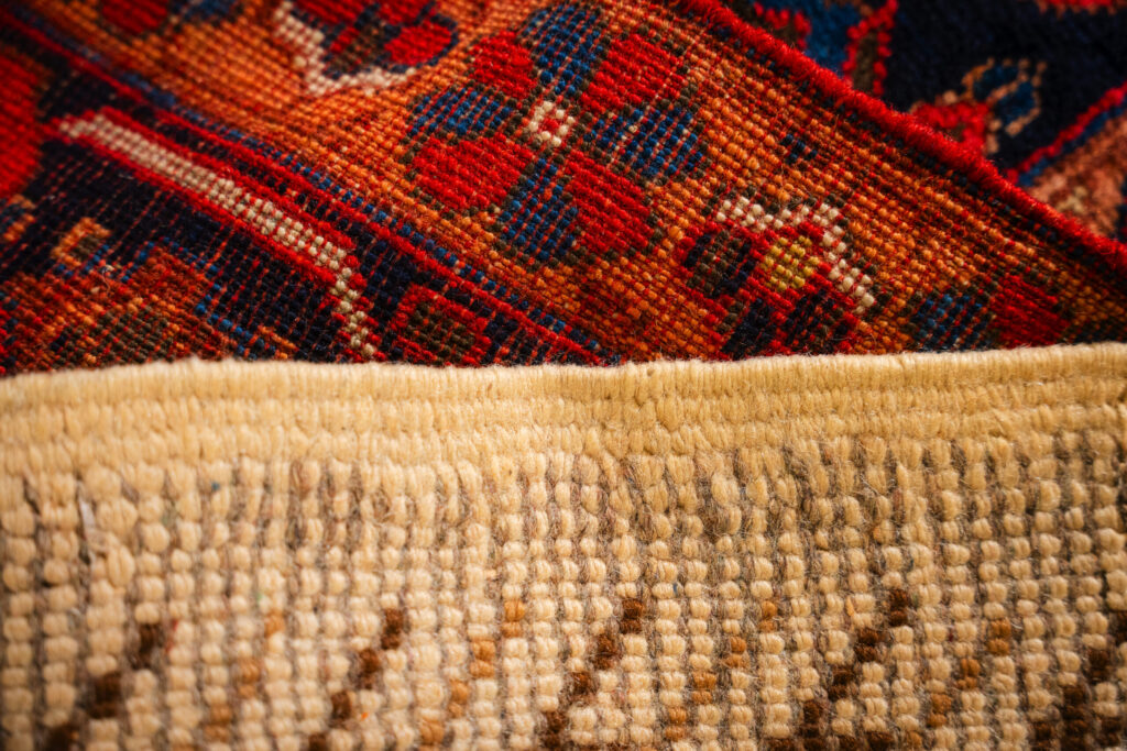 close-up comparison of a Turkish rug and a Moroccan rug showing differences in weave and color